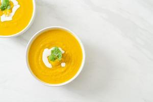 pumpkin soup in white bowl