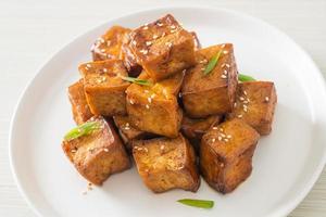 fried tofu with white sesame and teriyaki sauce photo