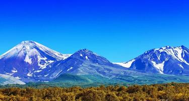 The Avachinsky and Kozelsky volcanoes in Kamchatka in the autumn photo