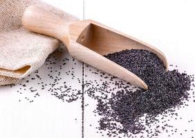 The Poppy seeds in a wooden spoon photo