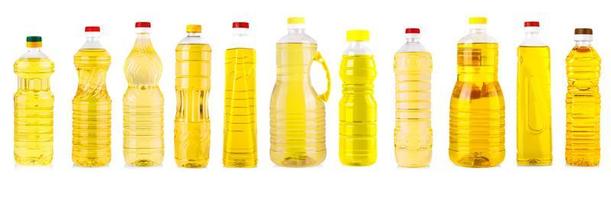 Set of Bottles of sunflower oil isolated on white photo