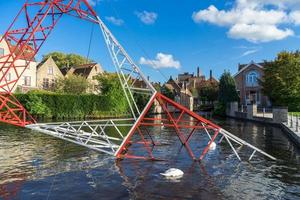 BRUGES, BELGIUM, 2015. Pylon in the Canal in Bruges photo