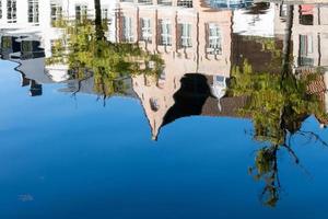 BRUGES, BELGIUM, 2015. Reflection in a Canal in Bruges photo