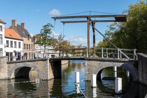BRUGES, BELGIUM, 2015. Bridge over a canal in Bruges West Flanders in Belgium photo