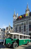 BRUGES, BELGIUM, 2015. Old Bus outside the Provincial Palace in Bruges photo