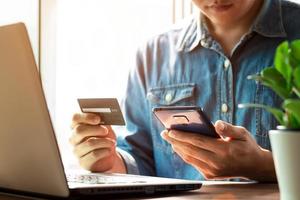 businessmen use their credit cards through mobile internet banking apps to shop online and digital payment ideas. photo