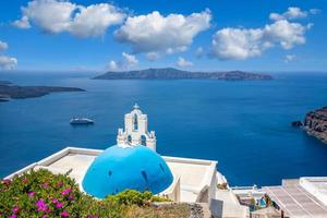 Amazing panoramic landscape, luxury travel vacation. Oia town on Santorini island, Greece. Traditional and famous houses and churches with blue domes over the Caldera, Aegean sea photo