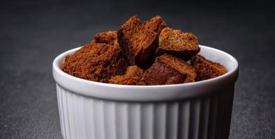 Breadcrumbs cut into cubes are perfect for soup, salad photo