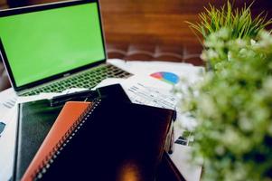 The desk and graph are placed on the business desk. Business concept With copy space photo