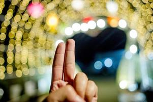 Hands and colorful lights On New Year's Day, Bokeh circle lights, background image with copy space. photo