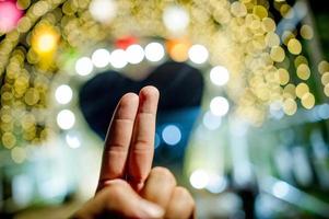 Hands and colorful lights On New Year's Day, Bokeh circle lights, background image with copy space. photo