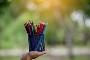 Hand and pencil pictures, green background color Education concept With copy space photo