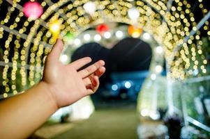 Hands and colorful lights On New Year's Day, Bokeh circle lights, background image with copy space. photo