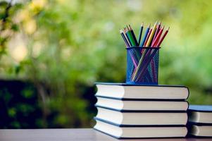 Picture of books and educational equipment placed on the table Educational concept with copy space photo