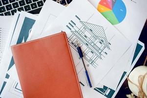 The desk and graph are placed on the business desk. Business concept With copy space photo