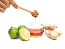 Ingredients for juice drinks of tea with honey, lime lemon citrus and ginger. photo