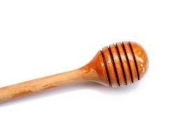 Top view of honey stick wooden tool isolated on white background. photo