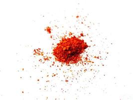 pile red paprika powder or cayenne pepper is spicy flavored food. photo
