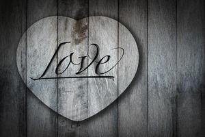 heart shape on old wooden background. photo