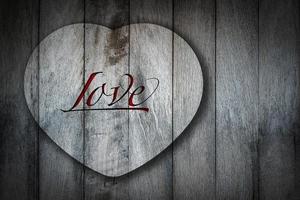 heart shape on old wooden background. photo