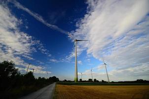 many windmills and clouds on sky photo