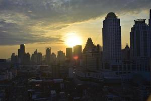 view of tall buildings in bangkok at sunrise