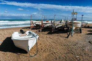 boats ashore on the sand photo