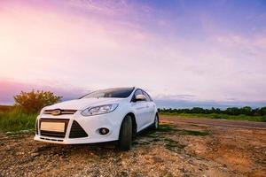 The sports car white in nature. photo