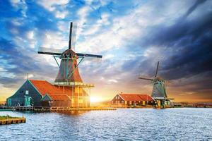 Cumulus clouds on sunset over dutch windmills in Rotterdam. Neth photo