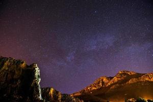 The starry sky above rocky dolomite photo