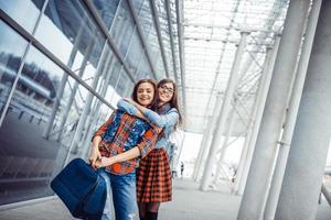 Girls having fun and happy when they met at the airport.Art proc photo