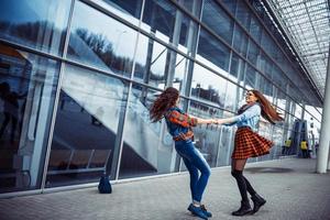 Girls having fun and happy when they met at the airport.Art proc photo
