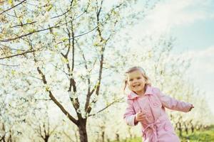 child running outdoors blossom trees. Art processing and retouch photo