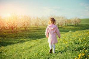 The little girl that runs in spring sunny day. Art processing an photo