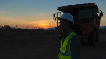 Silhouette of a large truck driver. Asian elders. photo