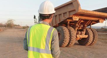 Truck driver  to inspect the truck photo