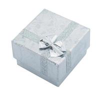 Gift box with silver ribbon bow isolated on white photo