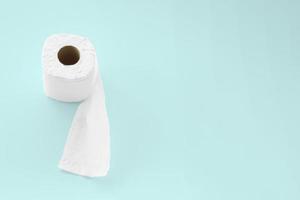 Tissue paper roll on light blue background. photo