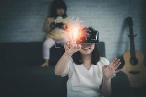 Asian woman wearing VR glasses virtual Global Internet connection metaverse, information security and encryption, secure access to user's personal information, secure Internet access, cybersecurity. photo