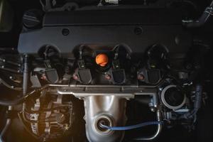 Under the hood of sports car. Powerful engine closeup. Close up detail of new car engine.Clean motor block. photo