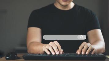 Searching Browsing Internet Data Information with blank search bar.businessman working with smart phone, tablet and laptop computer on desk in office. Networking Concept. photo