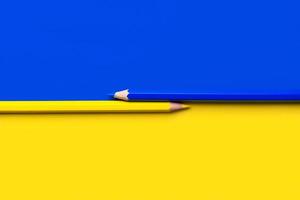 Flag of Ukraine with blue and yellow pencil with copy space photo