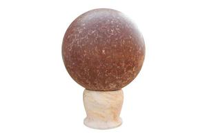 Spherical marble on a marble base isolated on a white background with a clipping path. photo