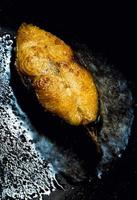 Mackerel pieces fried in a pan photo