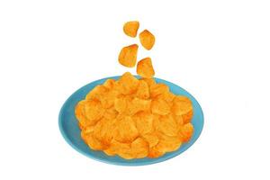 Potato chips falling down to the blue dish isolated on white background with clipping path. photo
