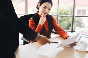 Young business staff asian woman and man work together. photo