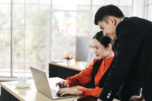 Adult asian business people working in office on day. photo