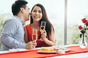 Adult asian lover couple man and woman dating dinner at restaurant on festive day. photo