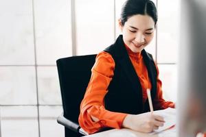 Social distance with business working woman sit in office. photo