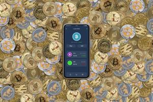 Smart phone with crypto exchange app on a pile of coins photo